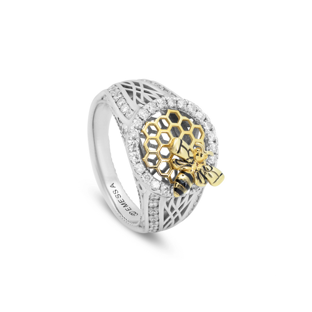 Angled view of two-tone 18ct gold honeycomb ring featuring a 3D bee motif and brilliant-cut diamonds.