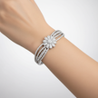 Model wearing Emessa 18ct White Gold Diamond Bangle, 4.25ct Floral Design – Diamond Symphony Bangle