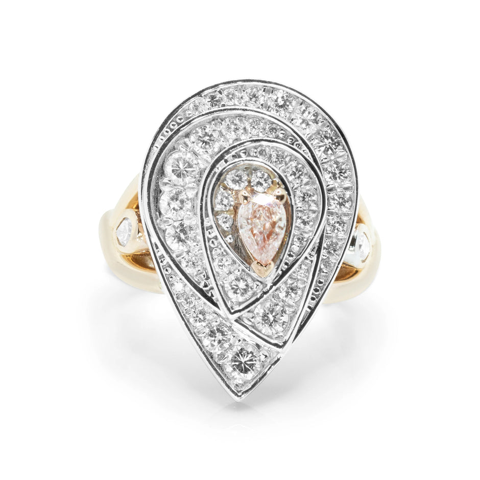 A top-down view of an 18ct rose gold Blush Teardrop ring featuring a 0.21ct fancy light purplish pink pear-cut diamond surrounded by a brilliant white diamond halo.