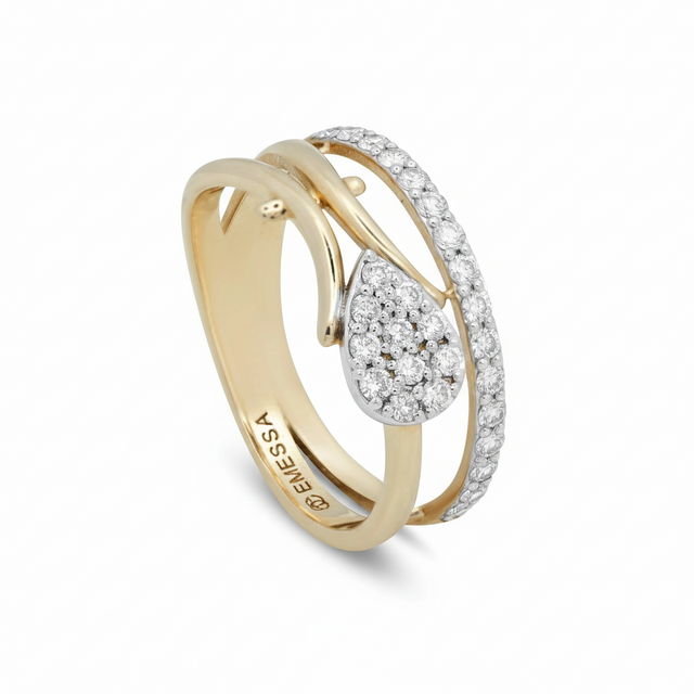 Angled view of 18ct yellow and white gold bypass ring with hand-sculpted leaf motifs and a pear-shaped natural diamond cluster (0.70ct).