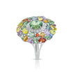 Angled view of the Emessa Aurora Garden 18ct yellow gold green tourmaline cluster ring with diamond and sapphire accents