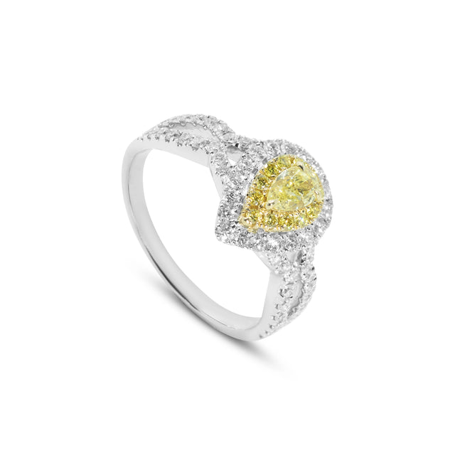 Perspective view showing the contrast between the yellow canary diamond and the 18ct white gold diamond-set band.