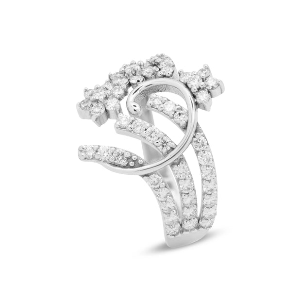 Angled view of 18ct white gold pierced floral cluster ring with 1.02ct of round brilliant-cut diamonds extending onto the shoulders.