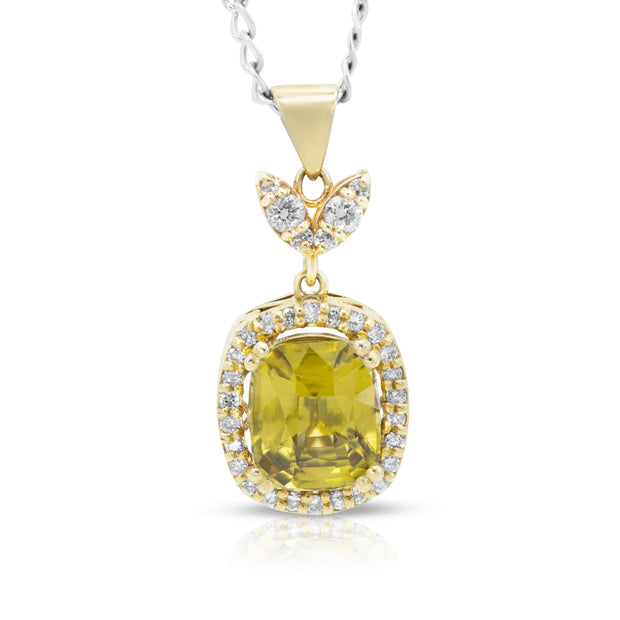 Front view of Olive Glow pendant in 14ct yellow gold featuring a 3.5ct cushion-cut greenish-yellow zircon surrounded by round brilliant-cut diamonds in a cushion-and-navette motif.