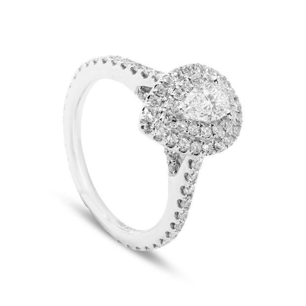 Angled view of 18ct white gold pear diamond ring with two small rubies set into the arch detail for added depth.