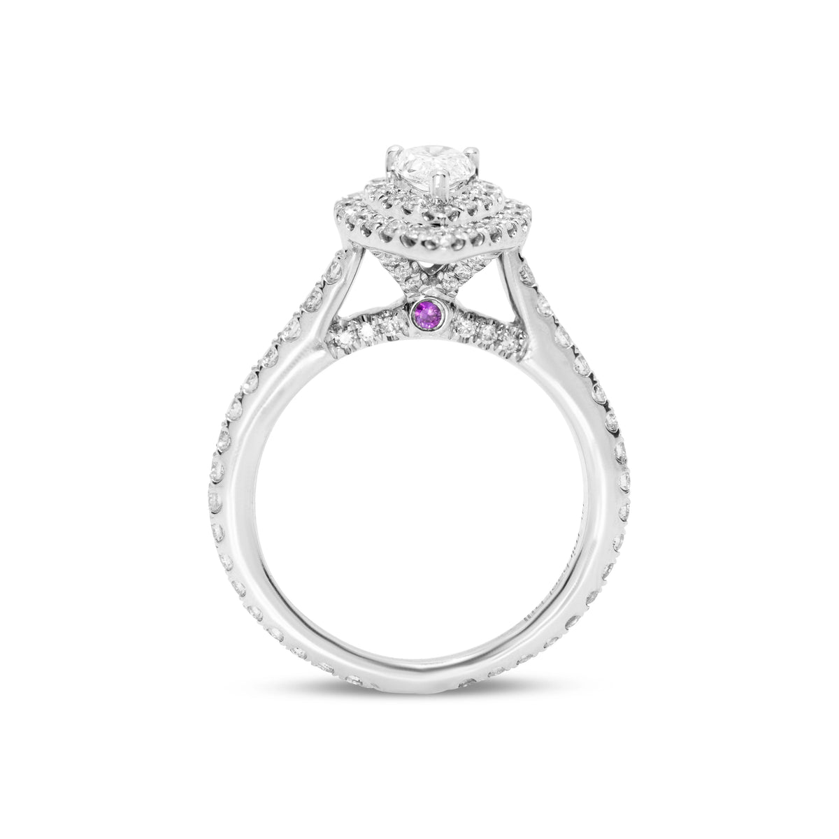 Front upright view of an 18ct white gold pear diamond ring with a visible ruby arch detail set beneath the centre stone