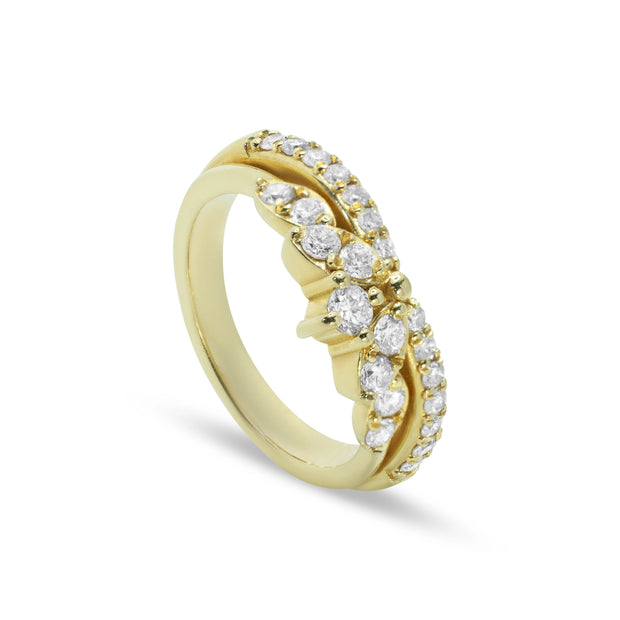 Angled view of 18ct yellow gold natural diamond ring highlighting polished finish and 0.65ct total diamond sparkle.