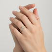 Sunlit Brilliance diamond ring worn on hand, showcasing natural diamonds totalling 0.65ct in 18ct yellow gold.