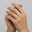 A model wearing the Canary Elegance ring, showcasing the vibrant yellow diamond and high-polish white gold finish.
